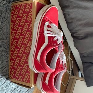 Lightly used red vans.